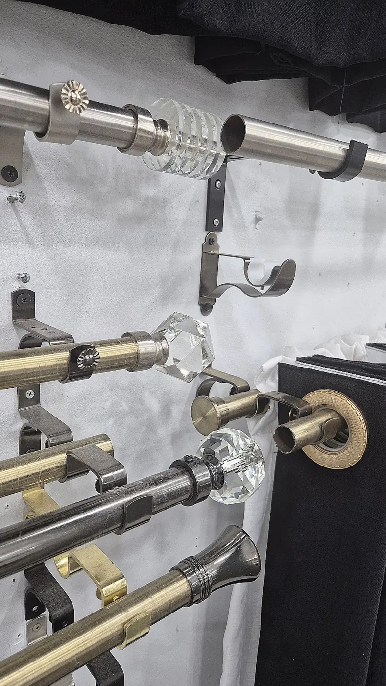 Brass and steel curtain rods with crystal finials