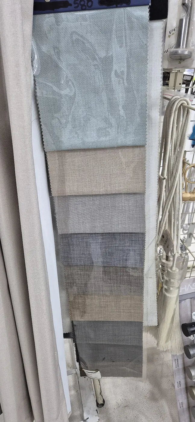 Fabric swatches in soft blue, beige and grey with pinked edges